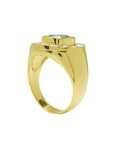 Men's 14K yellow gold horseshoe ring with a cushion-cut emerald and burnish-set diamonds.
