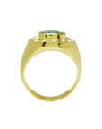Men's 14K yellow gold horseshoe ring with a cushion-cut emerald and burnish-set diamonds.