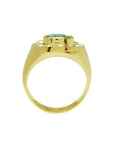 Men's 14K yellow gold horseshoe ring with a cushion-cut emerald and burnish-set diamonds.