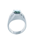 Men's 14K white gold ring with a deep greenish-blue oval sapphire and diamond accents.