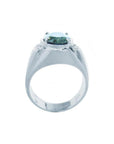 Men's 14K white gold ring with a deep greenish-blue oval sapphire and diamond accents.