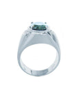 Men's 14K white gold ring with a deep greenish-blue oval sapphire and diamond accents.