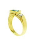 Men's 14K yellow gold ring with a deep green emerald and a side diamond.