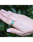 Men's 14K yellow gold solitaire ring with a square emerald-cut medium green Colombian emerald.