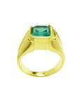 A yellow gold mens emerald solitaire ring bezel set displaying its lateral perspective.