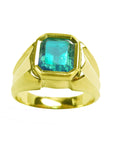 This natural emerald solitaire ring for men shows the top and its two sides design in yellow gold.