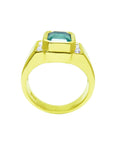 Gold ring with a natural colombian emerald and diamond accents on a white background.