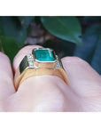 Men's 18K yellow gold ring with a rectangular 2.90 ct Colombian emerald and natural diamonds.