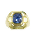 High-quality men’s sapphire solitaire ring featuring a certified untreated emerald-cut stone set in 18K yellow gold, with an octagonal mixed fancy emerald cut design.