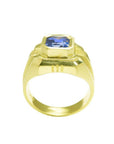 Men's 18K yellow gold ring with a vivid blue octagonal sapphire, bezel set.