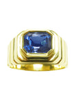 Men's natural sapphire solitaire ring bezel set crafted in 18k yellow gold, frontal top view