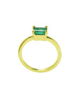 Minimalist 14K yellow gold solitaire ring with a rectangular green emerald.