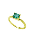 Minimalist 14K yellow gold ring with a prong-set, rectangular natural emerald solitaire.