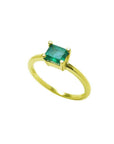 Minimalist 14K yellow gold ring with a prong-set, rectangular natural emerald solitaire.