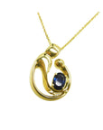 Front position top view of a mother and child sapphire necklace slider pendant crafted in 14k yellow gold