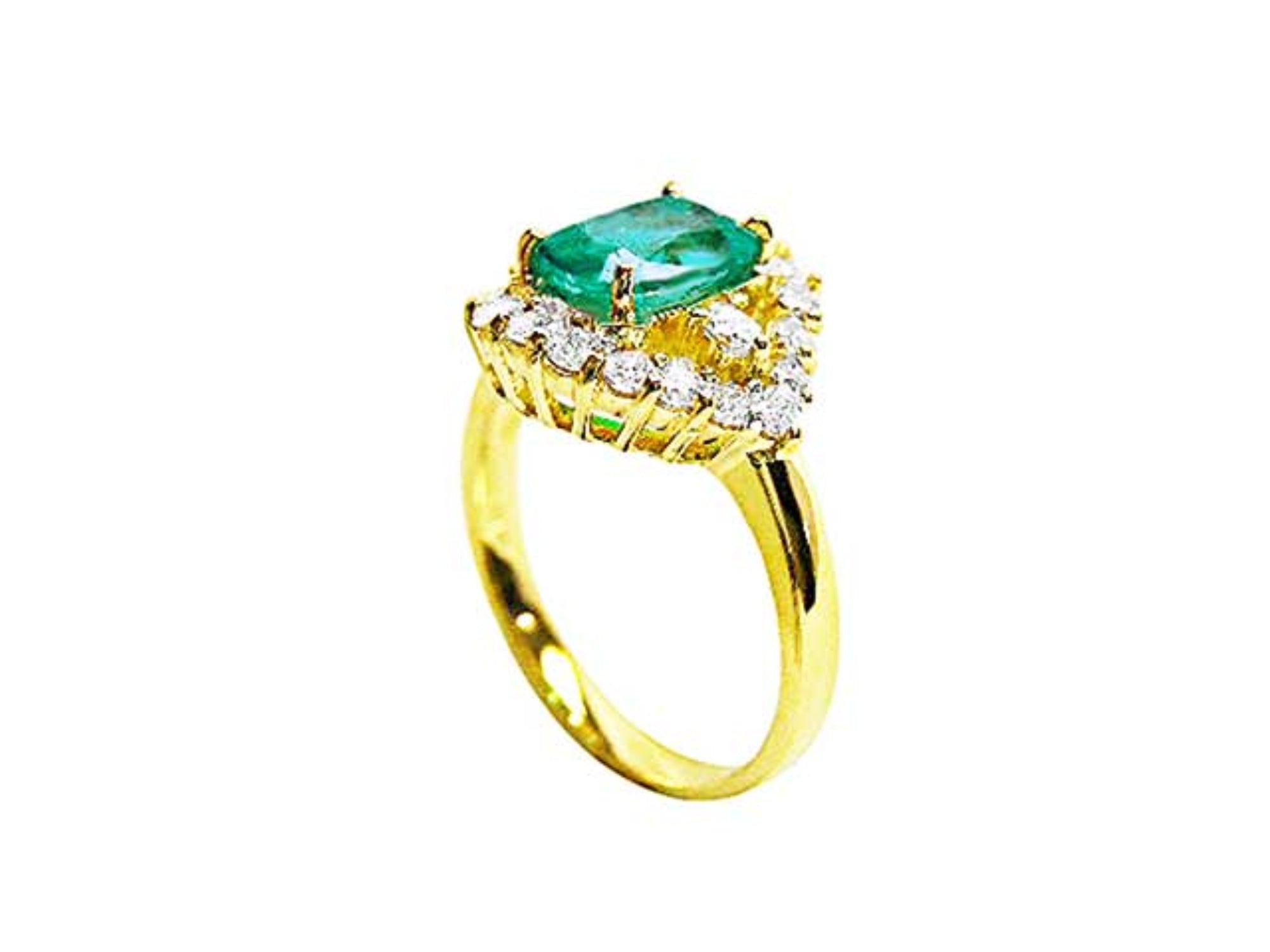 A cushion-cut Muzo Colombian emerald centerpiece ring encircled by diamonds, highlighting both the top view and the side profile of the band.
