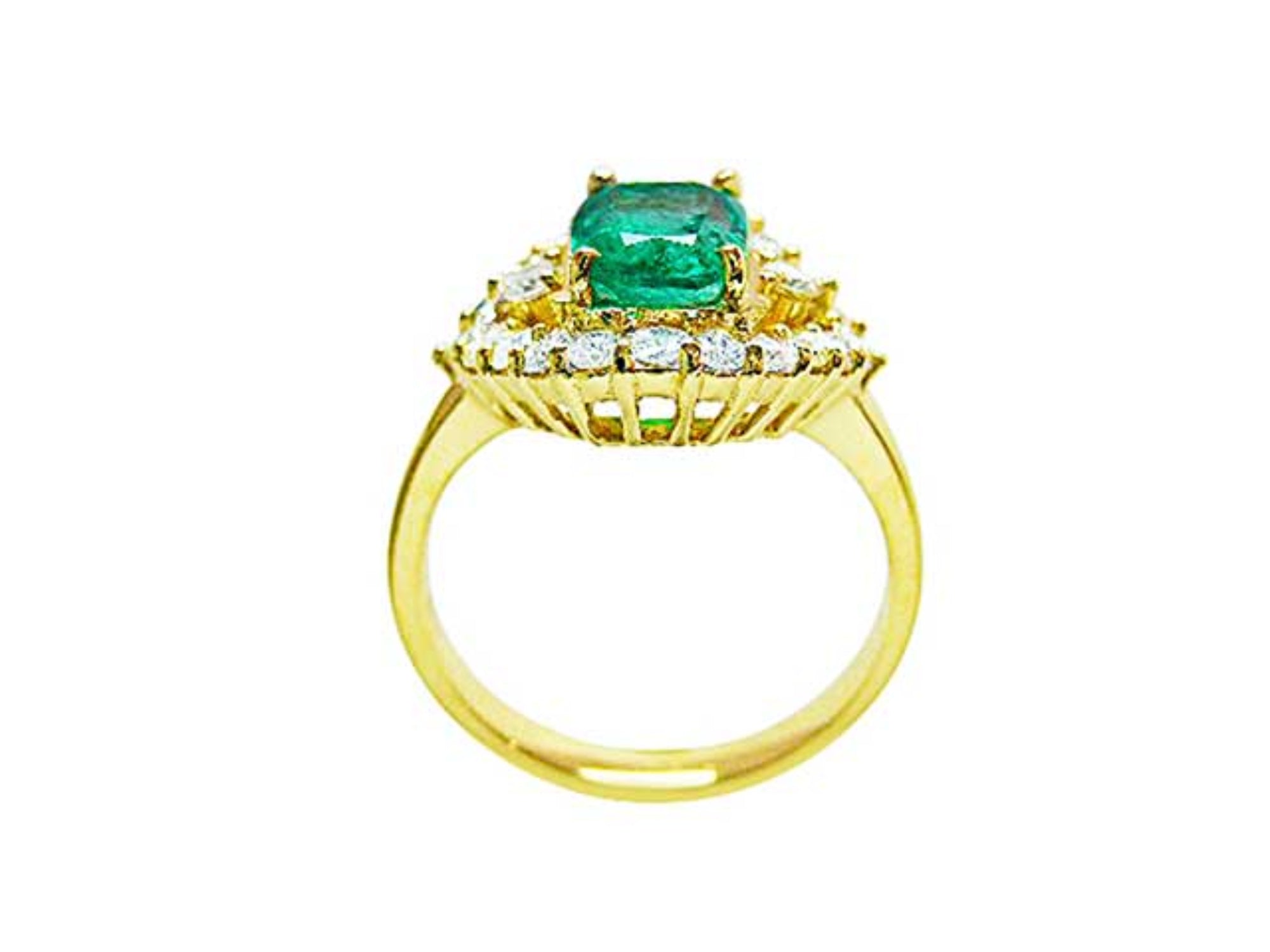 A yellow gold emerald ring displaying its lateral perspective fron the top setting. gallery and band ring.