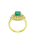 1.43 ct cushion-cut Muzo Colombian emerald ring with marquise diamond halo in 14K yellow gold.