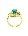 1.43 ct cushion-cut Muzo Colombian emerald ring with marquise diamond halo in 14K yellow gold.