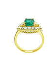 1.43 ct cushion-cut Muzo Colombian emerald ring with marquise diamond halo in 14K yellow gold.