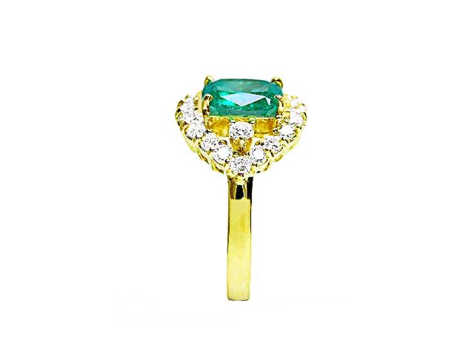 A Muzo colombian emerald ring displaying the top center piece, a halo diamond and the band in yellow gold.
