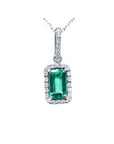 1.70 ct. Muzo Colombian emerald pendant with diamond halo in 18K white gold.