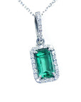Emerald-cut gemstone pendant with diamond accents on a white background