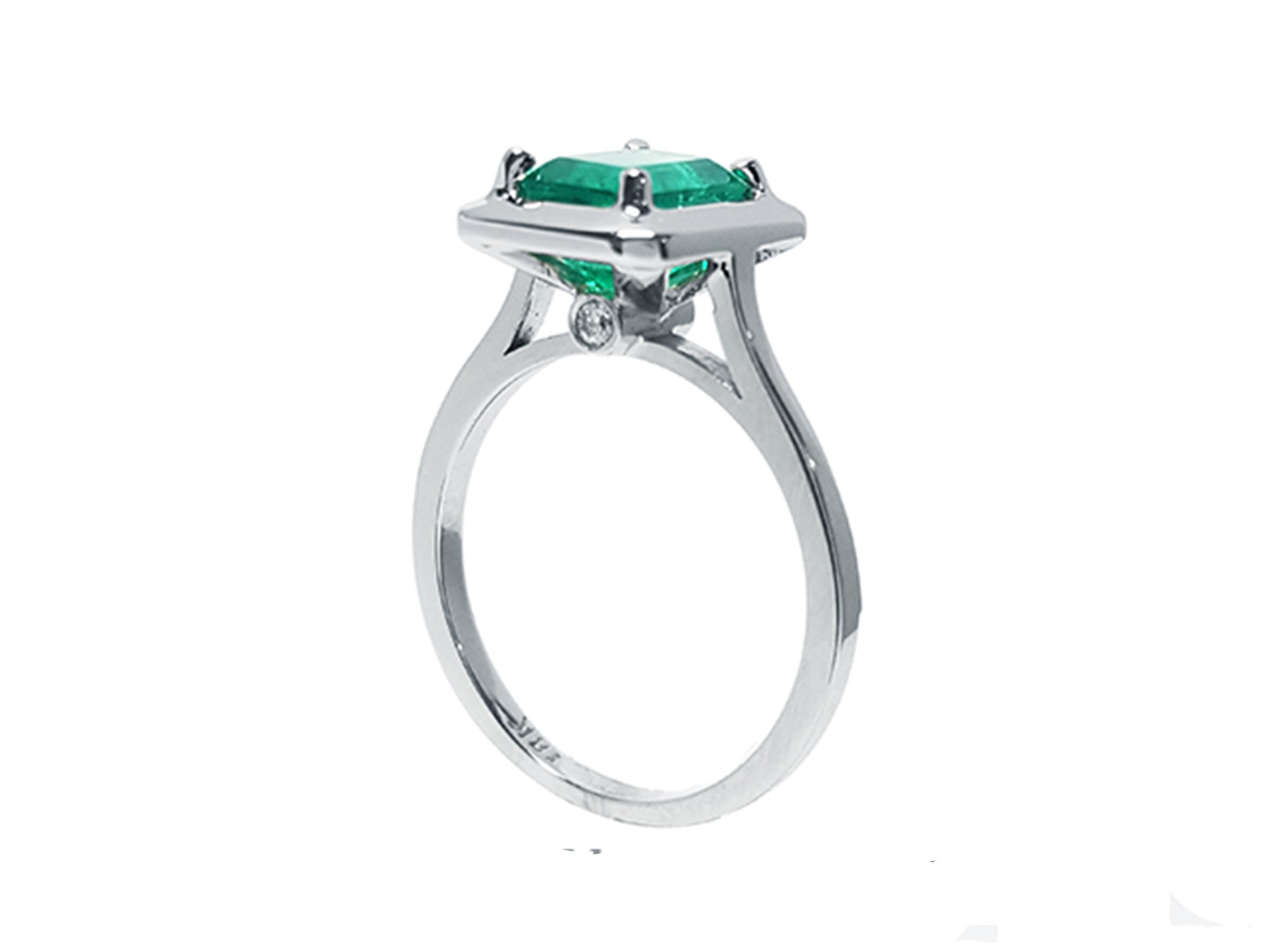 A half-side of this emerald solitaire ring shows the top and band profile on a white background.