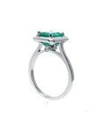 1.50 carat Muzo Colombian emerald solitaire ring in 18K white gold with a rectangular cut.