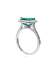 1.50 carat Muzo Colombian emerald solitaire ring in 18K white gold with a rectangular cut.