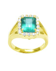 This top view of a yellow gold emerald ring shows the top gemstone and a halo diamond with sides profile.