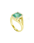 1.68 ct emerald-cut Muzo Colombian emerald ring with diamond halo and split shank 14k yellow gold.