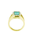 14k yellow gold ring with emerald-cut Muzo Colombian emerald, diamond halo, and split shank.