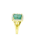 1.68 ct emerald-cut Muzo Colombian emerald ring with diamond halo and split shank 14k yellow gold.