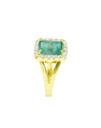 1.68 ct emerald-cut Muzo Colombian emerald ring with diamond halo and split shank 14k yellow gold.