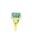 1.68 ct emerald-cut Muzo Colombian emerald ring with diamond halo and split shank 14k yellow gold.