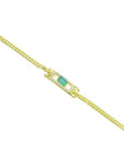 14K yellow gold bracelet with a rectangular Colombian emerald and diamond halo.