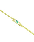 14K yellow gold bracelet with a rectangular Colombian emerald and diamond halo.