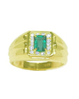 A 14k gold men’s ring featuring a natural Colombian emerald, accented by sparkling diamonds that frame the gemstone.