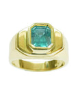May birthstone emerald Muzo mine colombian emerald bezel set solitaire ring for men in yellow gold.