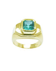 A bezel set natural colombian emerald solitaire mens emerald ring top and sides profiles view.
