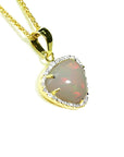 Natural Australian white opal pendant with red fire, diamond halo, and 14K yellow gold chain.