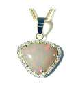 Trillion-cut Australian white opal pendant with red fire, diamond halo, and 14K yellow gold chain.
