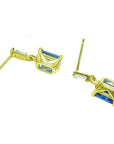 Natural blue sapphire earrings stud tapered baguette diamonds push backs, mixed upside-down positons profiles view