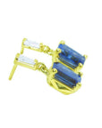 14K yellow gold blue sapphire emerald cut dangle earrings with tapered baguette diamonds.