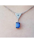 Necklace with a blue natural blue sapphire pendant emerald cut made of 14k white gold.