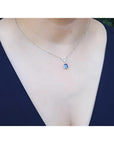 1.05 carat natural blue sapphire necklace in 14K white gold, with a trillion diamond centerpiece.