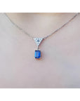 1.05 carat natural blue sapphire necklace in 14K white gold with a trillion diamond centerpiece.