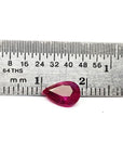 1.24 carat natural Burmese ruby, pear cut, brilliant medium red, shown next to a ruler.