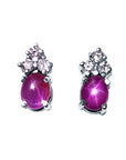 Natural star pink sapphire earrings cabochon and diamonds crafted in 14k white gold.